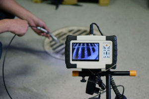 A professional technician employs the useful technique of a video inspection in Bloomington, IL.