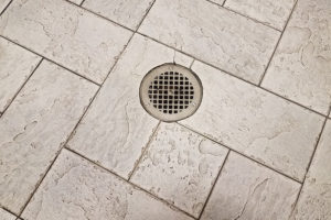 A basement floor drain is needed to prevent flooding in this Bloomington, IL residence.