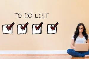 Girl in Decatur, IL writing a to-do list of things she needs to have done with her septic tank before the new year.