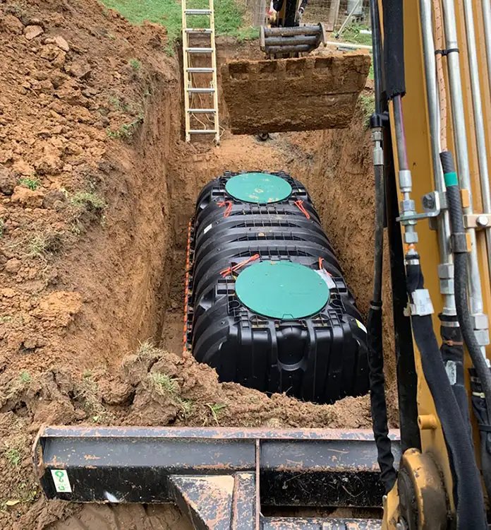 new septic tank being installed in the ground in bloomington il