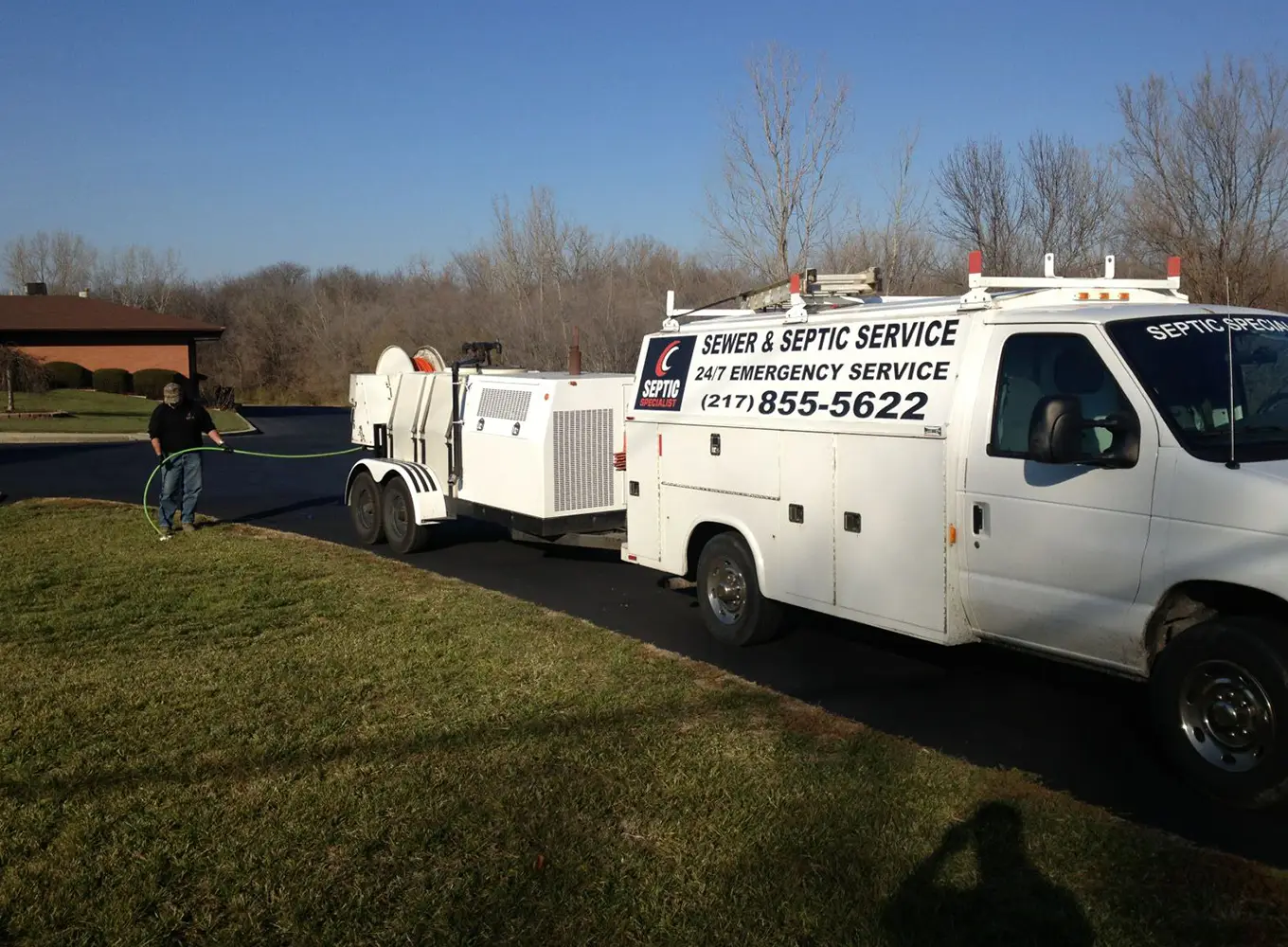 worker using sewer jetting equipment decatur il